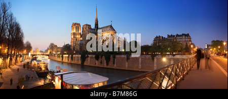 SEINE RIVER AND NOTRE DAME DE PARIS AT NIGHT Stock Photo