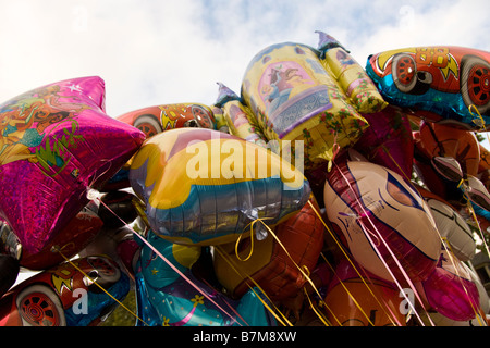 Inflatable brightly coloured balloons on sale at a fair in Leiden, Netherlands Stock Photo