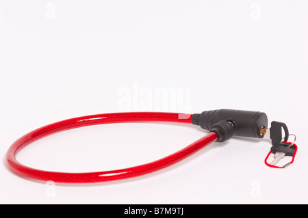 A close up of a bicycle lock and key on a white background Stock Photo
