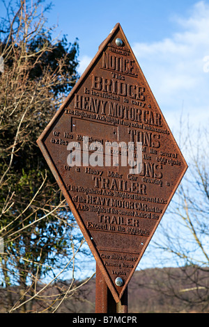 An old cast iron bridge weight limit sign Stock Photo - Alamy
