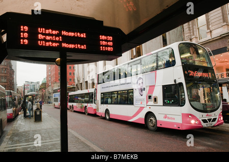Metro/translink/citybus buses lined up at Donegal Square West, Belfast with 'Bus Trak' electronic display Stock Photo