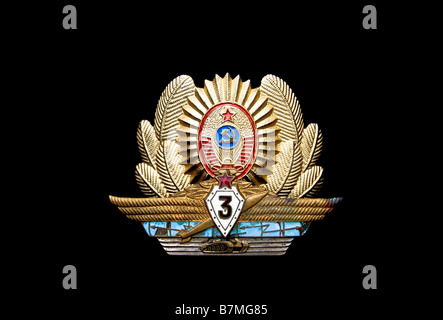 Soviet Army officer cap  badge and qualification badge isolated on black Stock Photo