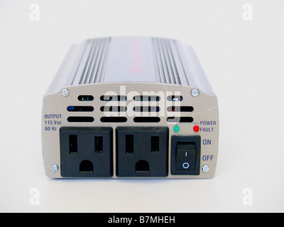 Small automotive AC/DC inverter shown in isolation. Stock Photo