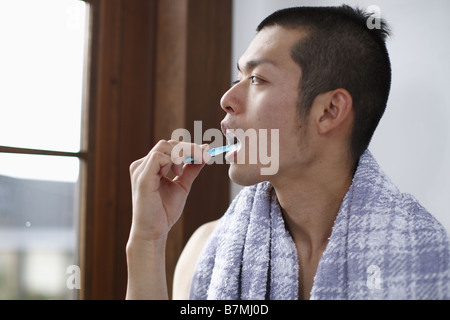 Man Brushing Teeth Stock Photo