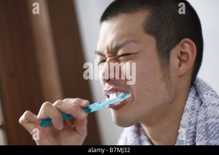 Man Brushing Teeth Stock Photo