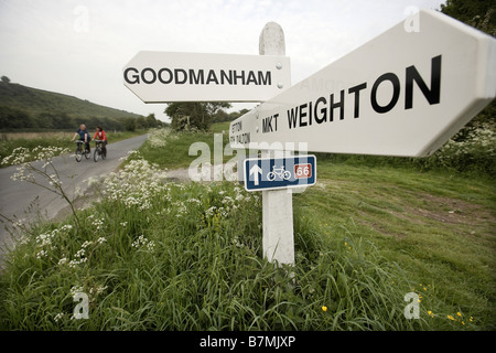 Couple cycling on route 66 near Market Weighton and Goodmanham The Wolds East Yorkshire UK Stock Photo