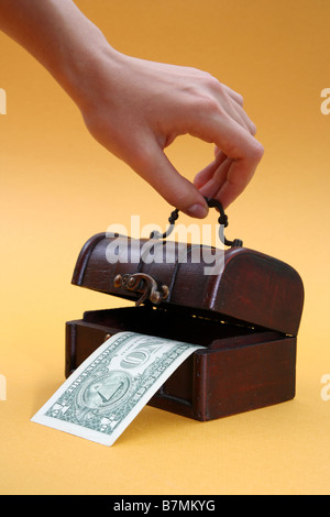 Wood cashbox isolated on yellow Stock Photo