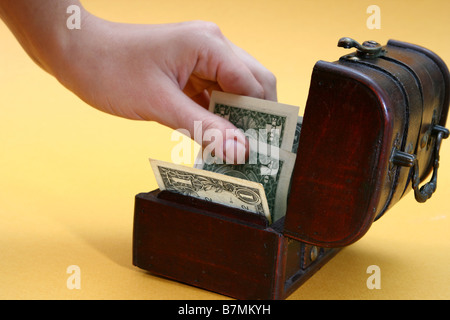 Wood cashbox isolated on yellow Stock Photo