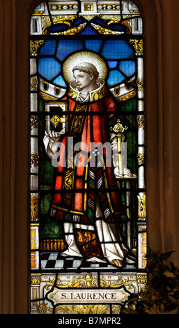 St Lawrence Church Morden Surrey England Stained Glass Window of St Laurence Stock Photo