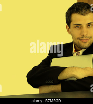 Businessman with laptop in his hands isolated on white Stock Photo