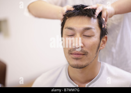 Man having a head massag Stock Photo - Alamy
