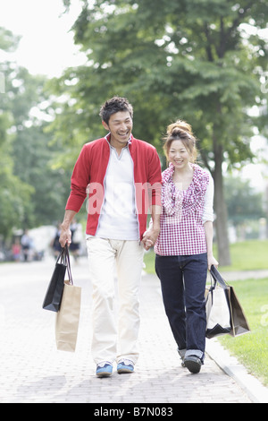 Smiling Couple Walking Together Stock Photo