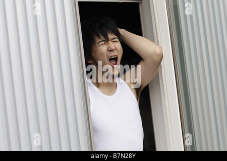 Sleepy Man Yawning Stock Photo