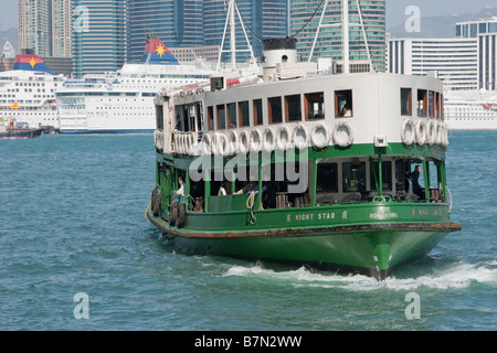 A traditional green and white Star Ferry in Victoria Harbour, Hong Kong ...