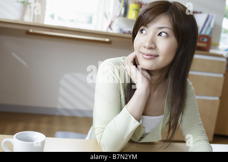 Young Woman Looking Sideways Stock Photo