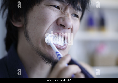 Man Brushing Teeth Stock Photo