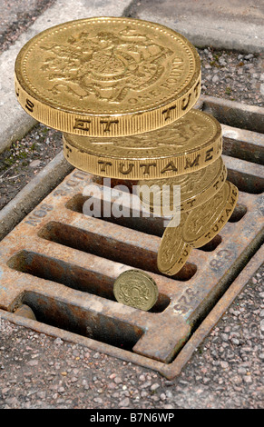 money down the drain Stock Photo