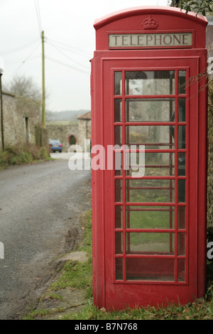 A shot of an old style red phone box once popular in the UK Stock Photo