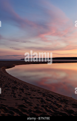 Sunrise Reflected on Au Train River where it Flows into Au Train Bay on Lake Superior Michigan Stock Photo