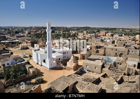 Oasis town of Al Qasr in western desert of Egypt with old town and mosque Stock Photo