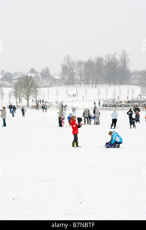 A winter snow scene view Across Priory Park Reigate Surrey In The Snow Stock Photo