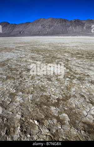 Cracked and dried mud of the playa a dried lake bed facing the Calico Mountains Black Rock Desert Gerlach Nevada Stock Photo