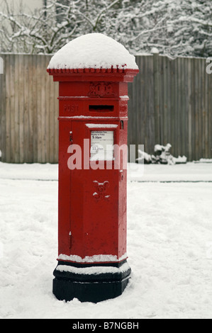 Snow covered victorian post box Stock Photo