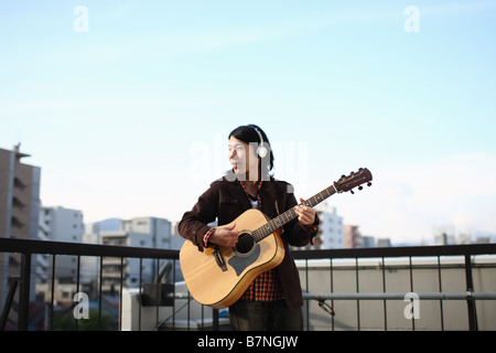 Man playing the guitar Stock Photo
