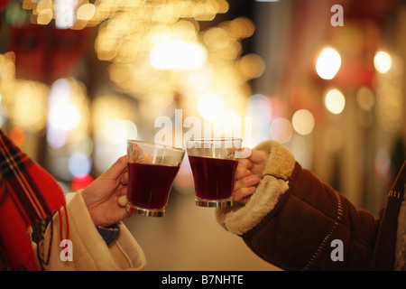 Couple toasting with hot wine Stock Photo