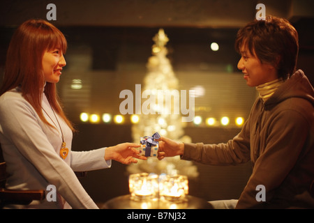 Man giving a present to woman Stock Photo