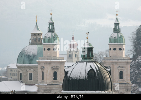 Towers of Franziskanerkirche and Salzburg Cathedral in the historic centre of Salzburg, Austria. View from Monchsberg hill. Stock Photo