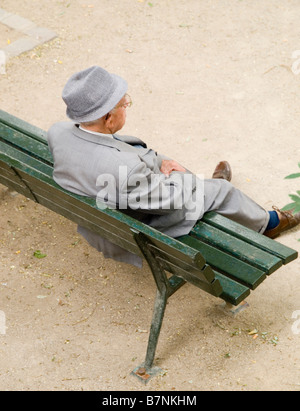 An old man sitting on a bench in the Montmartre district of Paris, France Europe Stock Photo
