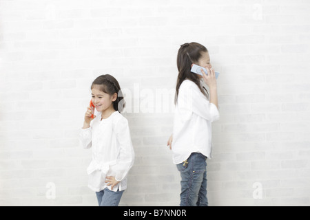 Children using mobile phones Stock Photo
