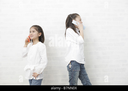 Children using mobile phones Stock Photo