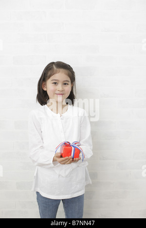 A girl holding a gift box Stock Photo