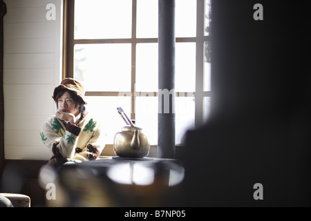 A young man resting chin on hand Stock Photo