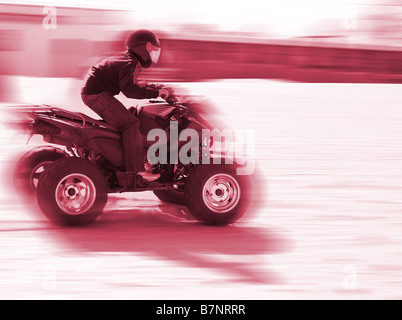 close up of a man driving a quad Stock Photo