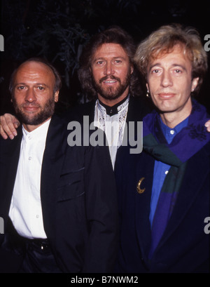 The Bee Gees, Barry (left) and Robin Gibb pose for photographers after ...