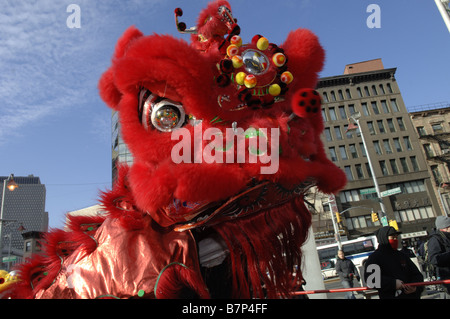 Lion dancing on the streets of New York City s Chinatown to celebrate Chinese New Year Stock Photo