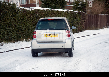 2007 Smart car sliding on icy road Stock Photo