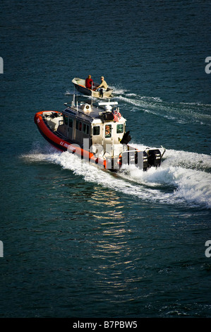 A small boat is intercepted by the US guard coast. Stock Photo