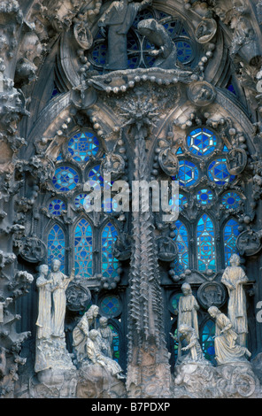 Religous carvings with stained glass form a vista on the Sagrada Família in Barcelona Stock Photo