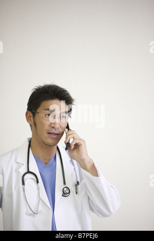 Doctor calling cell phone Stock Photo