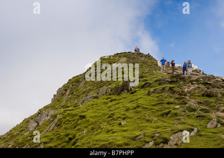 Summit of mount Snowdon Wales on sunny day with walkers Stock Photo