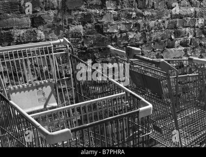 Shopping carts parked in an alley way Stock Photo