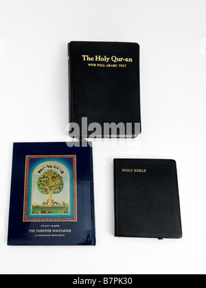 Holy Books Bible Quran and Haggadah Stock Photo