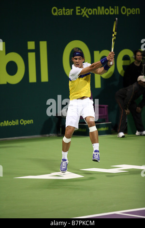 Rafael Nadal in action against Gael Monfils of France at the Qatar Open January 2009 Stock Photo