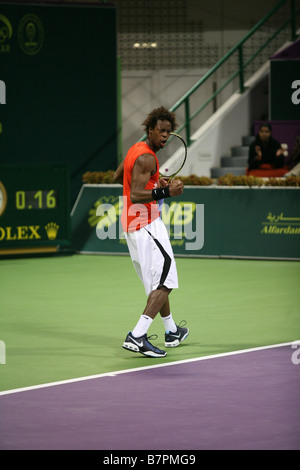 Gael Monfils of France celebrates after winning a point against Rafael Nadal during their Qatar Open match 2009 Stock Photo