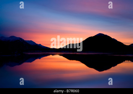 Pre-dawn light reflecting in Gastineau Channel Juneau Alaska Southeast Winter Stock Photo