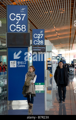 Modern departure gate information board at new Beijing Airport Terminal 3 China 2009 Stock Photo